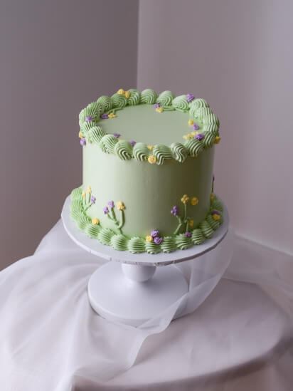 birthday cake with hand piped flowers