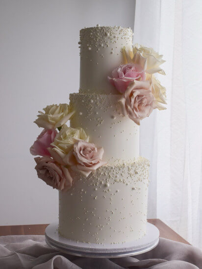 Wedding Cake with pearls and some flowers